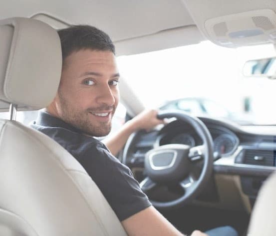 Professional chauffeur smiling